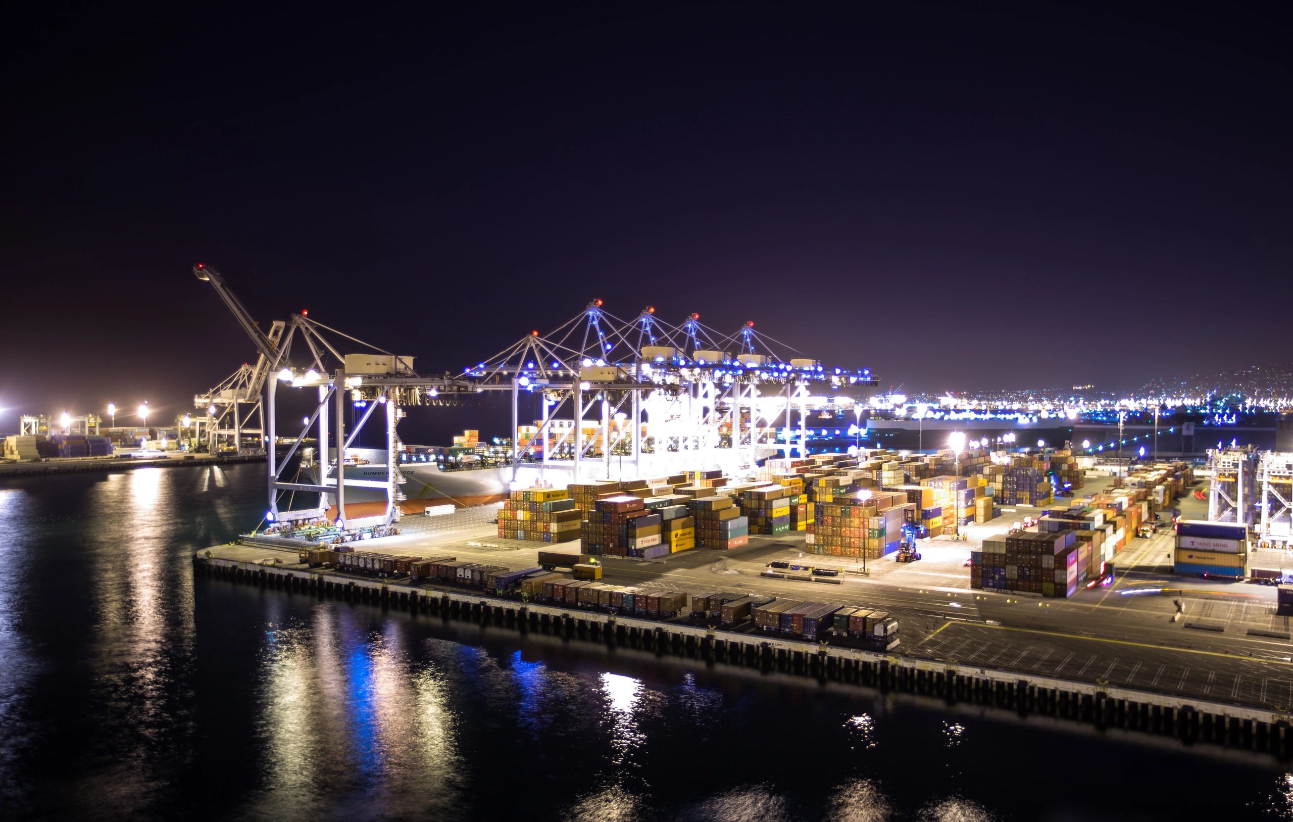 Shipping containers at a European trade port representing CBAM and import planning